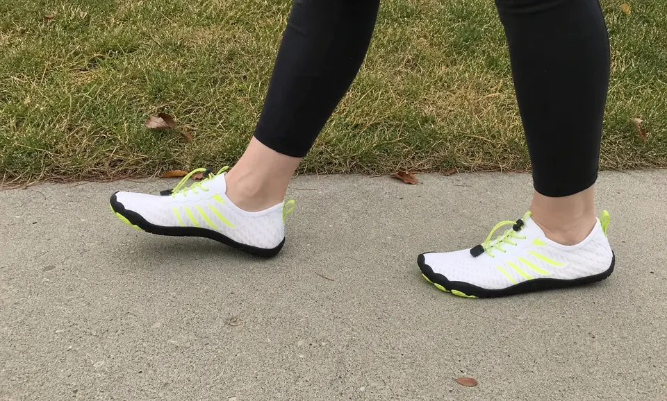 White Grounded-style shoes worn during a neighborhood walk